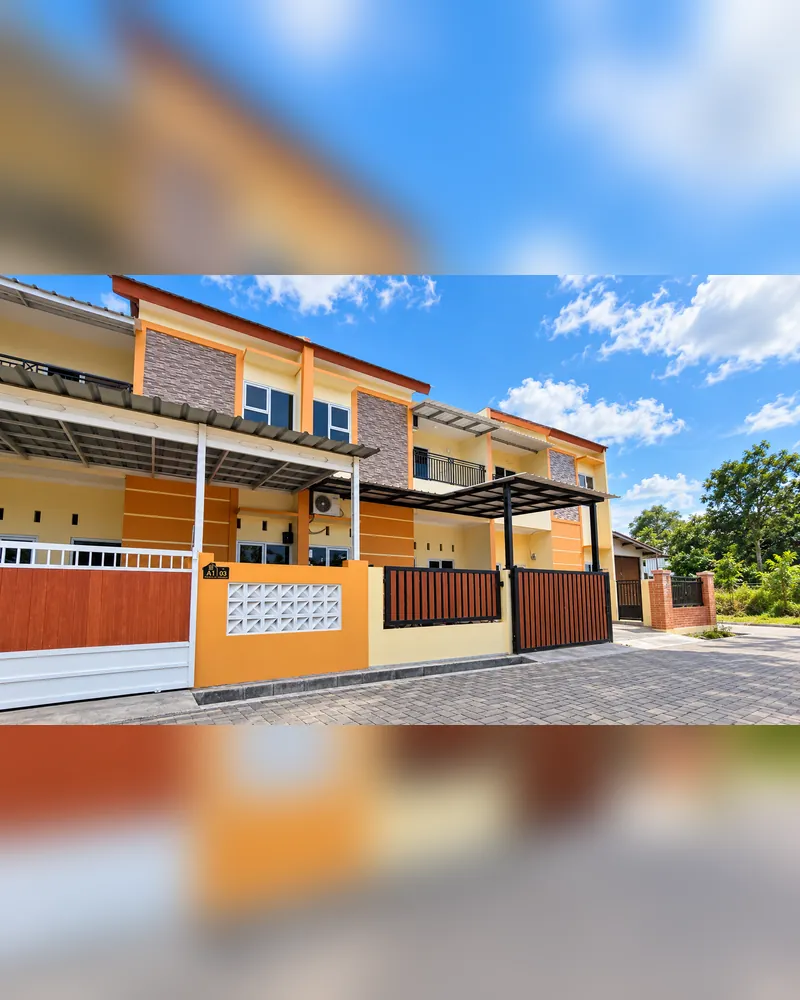Tampak depan unit Tipe 50/60 dengan carport dan balkon lantai 2